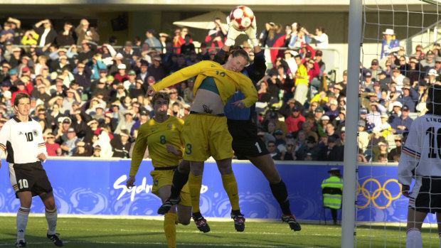Alicia Ferguson making life uncomfortable for the German goalkeeper at the 2000 Sydney Olympic Games.