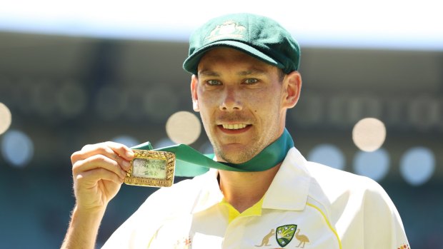 Scott Boland of Australia poses with the Johnny Mullagh medal after his performance at the MCG.  