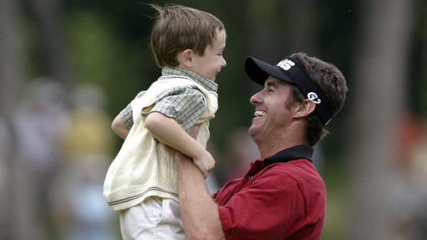 Mark Hensby with son Chase after he won the John Deere Classic in 2004.