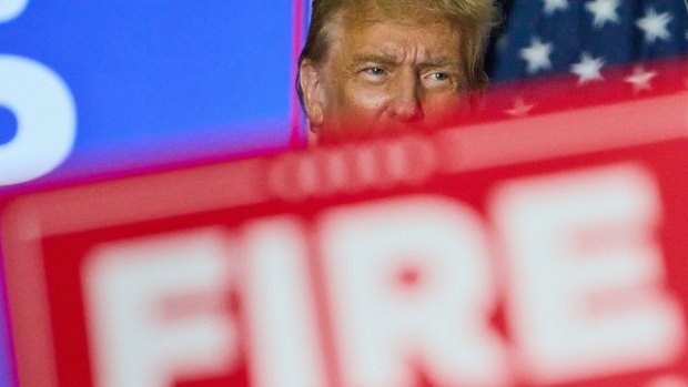 Former US president Donald Trump during a campaign event in Green Bay, Wisconsin, on Tuesday. The campaign banner reads “fire Biden”.
