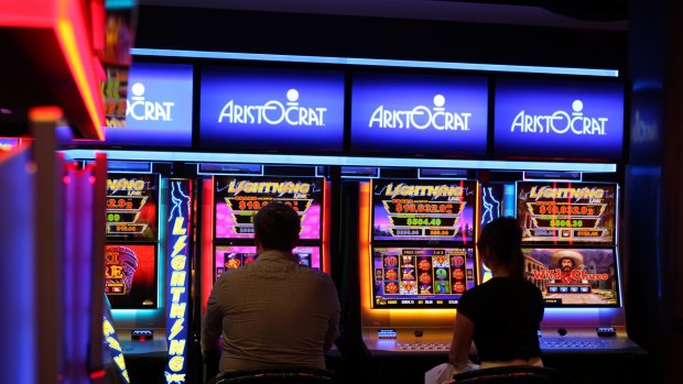 Five people playing pokies were held at gunpoint overnight.