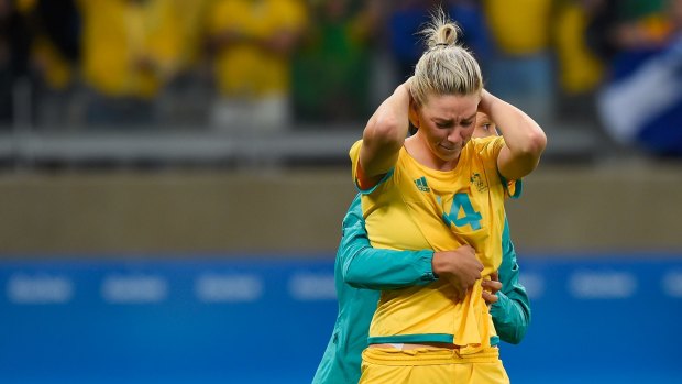 Heartbreak: Alanna Kennedy is comforted after missing the final penalty in the Matildas' loss to Brazil at the 2016 Rio Olympics.