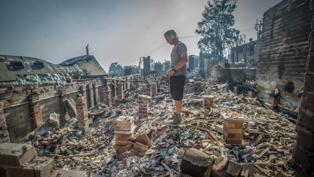 John Blankenstein visits the home of his parents-in-law to see the devastation caused during the Tathra bushfires. 