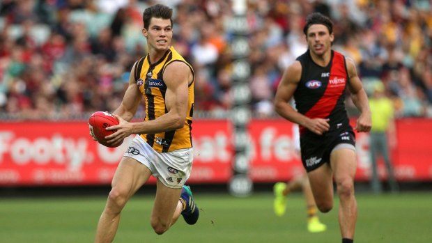 Playing catch-up: Jaeger O'Meara of the Hawk streams ahead.