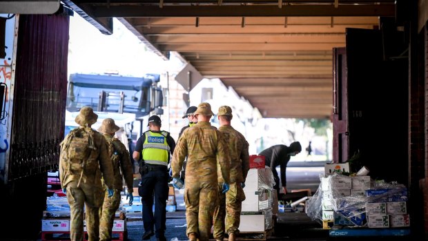 Victoria Police and ADF personnel patrolling Melbourne CBD during the stage four COVID-19 lockdown. 