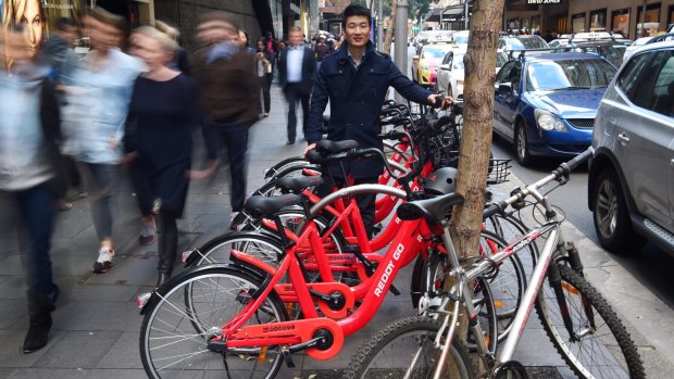 Reddy Go founder Donald Tang with dozens of bikes ready to hit the streets last July.
