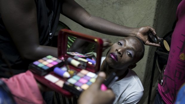 A participant in a Mr and Miss Pride beauty contest prepares backstage at an undisclosed venue in Kampala, Uganda, in 2015. Gay Ugandans say they are living in fear of being arrested since a stricter law passed this year.
