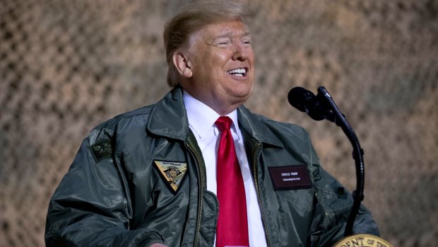 Donald Trump speaks at a hanger rally at Al-Asad Air Base in Iraq during a lightning visit on Wednesday.