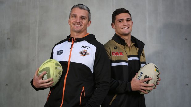 Ivan Cleary in his Tigers tracksuit alongside Nathan in his Panthers gear.