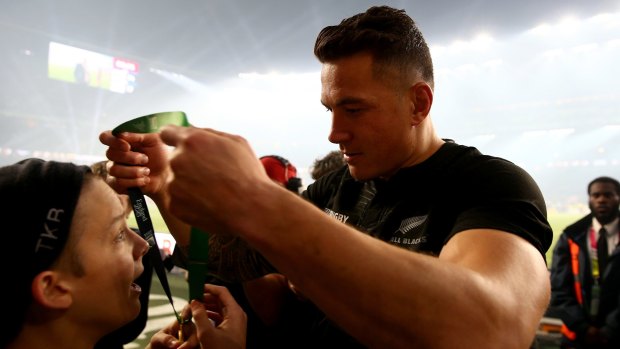 Sonny Bill Williams hands his medal to Charlie Lines.
