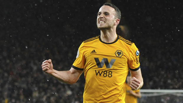 Not bad for openers: Diogo Jota celebrates scoring Wolves' first goal in their win over Manchester United.