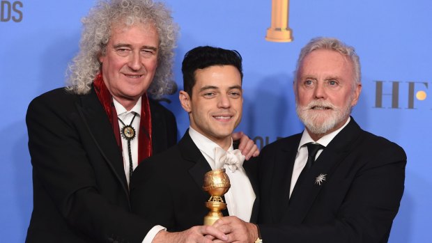 Brian May, left, and Roger Taylor, right, of Queen, and Rami Malek with the award for best motion picture, drama for Bohemian Rhapsody at last month's Golden Globes.