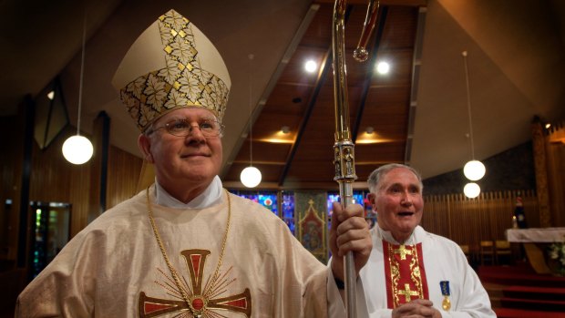 Australian Catholic Bishops Conference president Archbishop Mark Coleridge, left, has released the Australian Catholic Church's response to the child abuse royal commission.