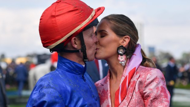 Stayer: There is no better jockey over long distances than Kerrin McEvoy, here with wife Cathy after yesterday's win.
