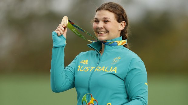 Proud: Catherine Skinner shows off her gold medal in the women's trap event.