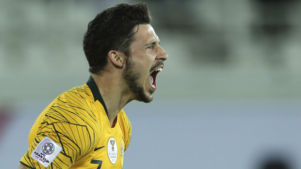 Australian forward Mathew Leckie celebrates after scoring the winning penalty.
