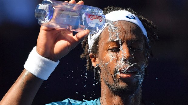 Gael Monfils attempts to cool down during a scorching day at the last Open.
