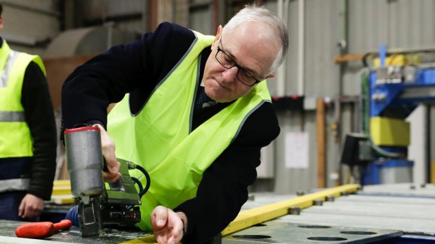 Malcolm Turnbull this week at Canberra business Universal Trusses, still spruiking business tax cuts he is destined to ditch before the election.