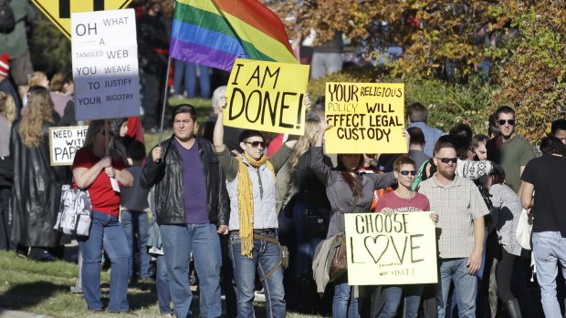 People gather for a mass resignation from the Church of Jesus Christ of Latter-day Saints in Salt Lake City in 2015 after the church targeted gay members and their children.