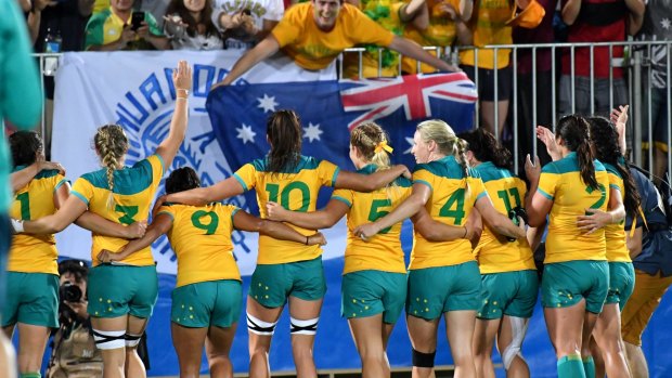 Australia's victorious rugby sevens team salute their fans after the final at the Rio Olympics