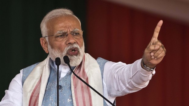 Indian Prime Minister Narendra Modi addresses a public rally in Changchari, on the outskirts of Gauhati, India, on Saturday.