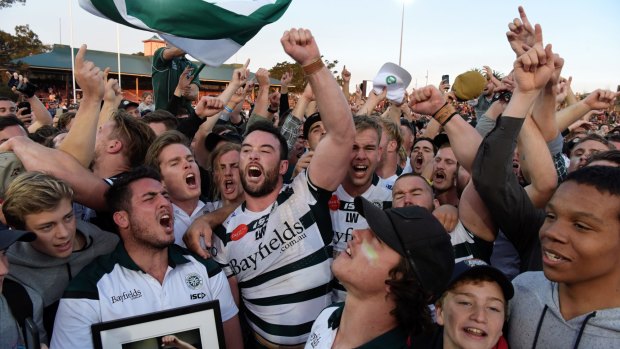 Champions: Warringah players and fans celebrate their 2017 Shute Shield grand final victory.