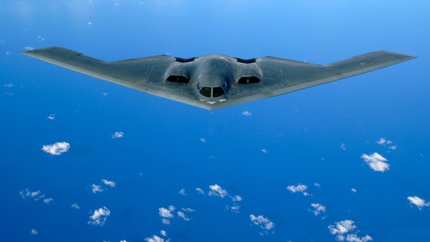A B-2 stealth bomber flying over the Pacific Ocean.