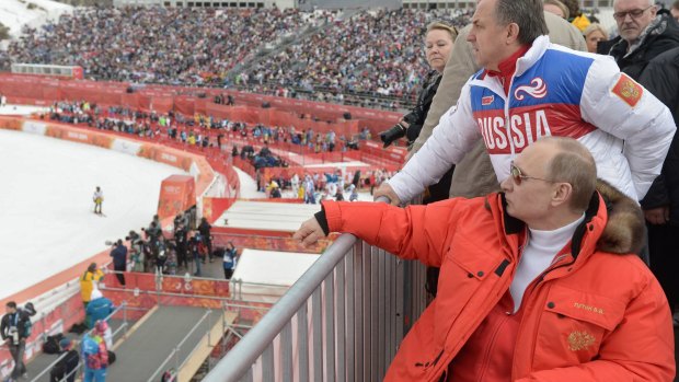 Russian president Vladimir Putin and sport minister Vitaly Mutko watch the 2014 winter Olympics in Sochi.