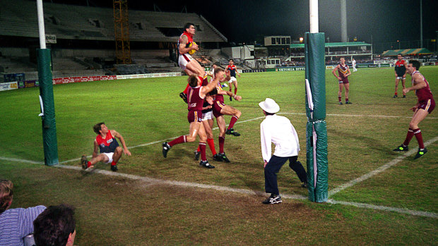 Playing days: Shaun Smith flies high above the pack to take a grab for Melbourne.