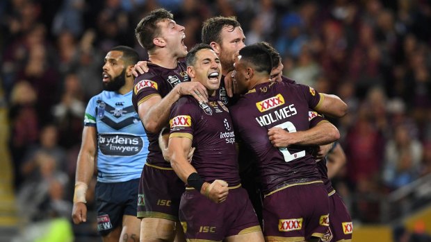 Team spirit: Billy Slater reacts after Daly Cherry-Evans scores the match-sealer.