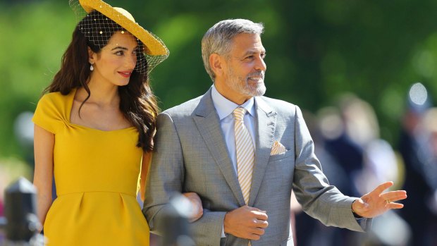Amal Clooney and George Clooney arrive.
