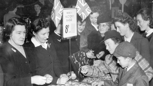 Women and children buying victory badges in Melbourne.