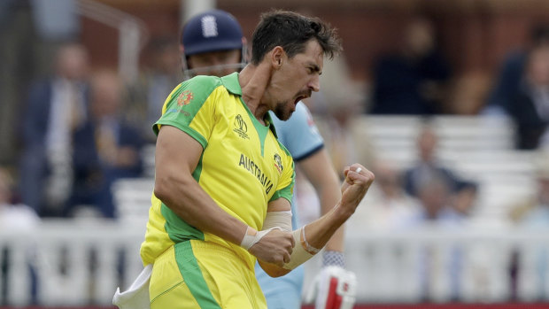 An explosive Mitchell Starc celebrates a wicket.