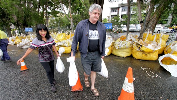 Everton Park residents fetch sandbags from the Newmarket SES depot during a previous flood.