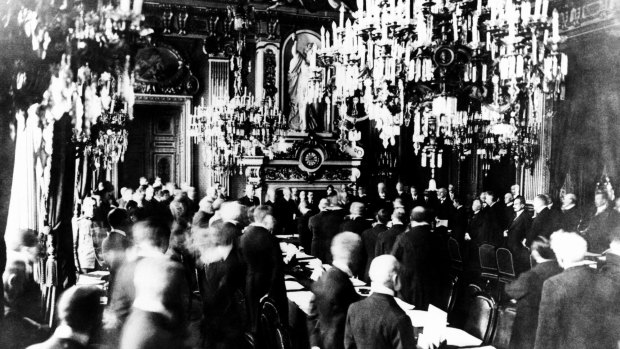 Representatives of the Allied Powers and Germany gather during the signing of the treaty marking the close of World War I at Versailles in Paris, France. 28 June 1919.