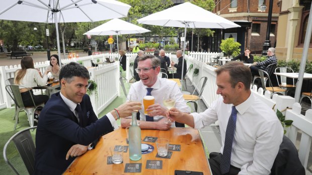 Minister for Customer Service Victor Dominello (left), enjoys a drink with NSW Treasurer Dominic Perrottet and Minister for Planning and Pubic Spaces Rob Stokes in The Rocks.