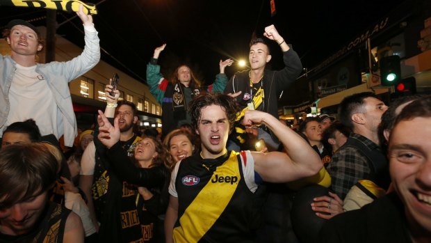 Richmond fans celebrate in Swan Street after the 2019 AFL grand final.