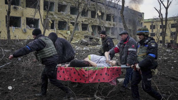 A pregnant woman is stretchered from a maternity hospital in Mariupol, after an air strike described by world leaders as a “war crime”. 