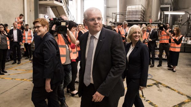 Liberal MP Melissa McIntosh, at right, visits a manufacturing business in her electorate with Prime Scott Morrison. She wants to see Australia get stronger on intellectual property theft.