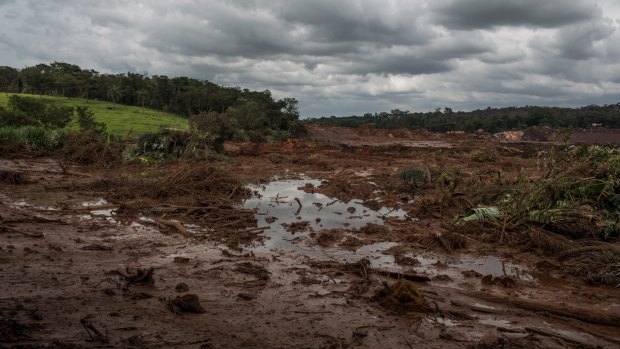 Water and mud from the failed tailings dam at Brumadinho in Brazil. The collapse of another Vale tailings dam and the impact of Cyclone Veronica on the Pilbara miners have removed 100 million tonnes of iron ore from the market this year.
