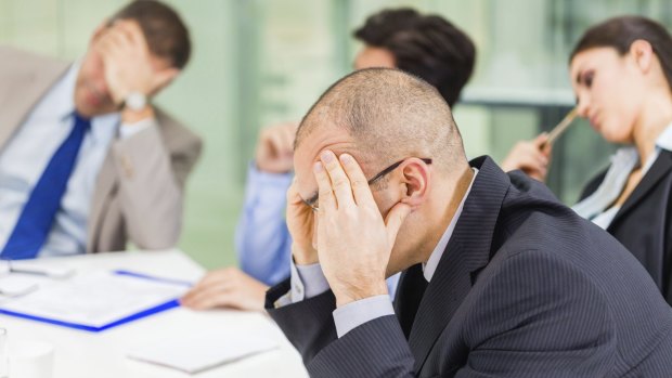 This stock image of ‘stressed out office workers’ accurately reflects how this whole scenario made me feel.