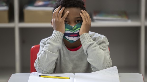 A student wears a mask on the first day back to in-person classes amid the COVID-19 pandemic in Sao Paulo, Brazil. Sao Paulo state government has allowed the schools to resume classes with up to 35 per cent of its students. 