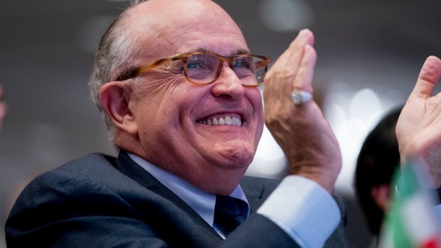 All smiles: Rudy Giuliani became a human smoke screen for the president.