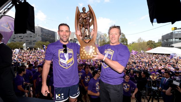 Champions: Storm skipper Cameron Smith and coach Craig Bellamy with the NRL trophy.