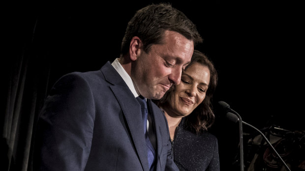 Matthew Guy concedes with the support of his wife Renae on Saturday night.