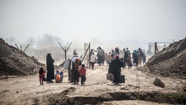 Civilians flee west Mosul as fighting between Iraqi forces and Islamic State militants intensifies in 2017. 