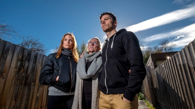 Rien Low with his sister Brooke and mother, Jenny, who had to battle Suncorp Bank.