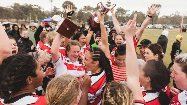 The Tuggeranong Viqueens celebrate their first grand final win since 2010.