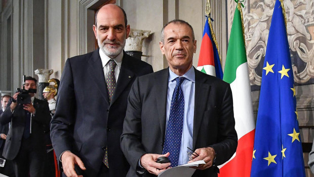 New premier-designate Carlo Cottarelli, right, after meeting with Italian President Sergio Mattarella.