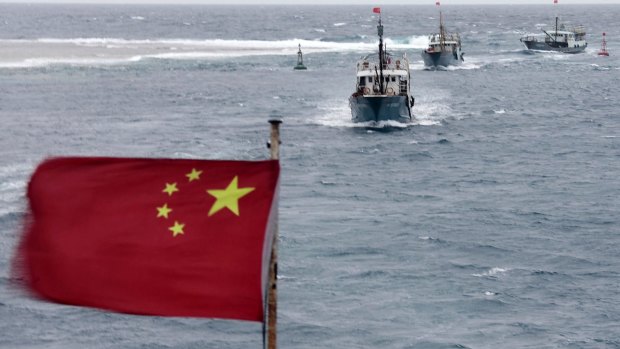 Malaysia's PM Mahathir Mohamad says bigger naval ships in the South China Sea raise the chances of conflict.  Pictured: Chinese fishing boats off the island province of Hainan in the South China Sea.